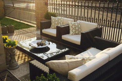 Patio - mid-sized transitional front yard brick patio idea in Boston with no cover