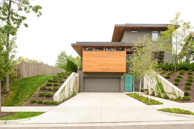 Mid-sized 1960s gray two-story mixed siding flat roof idea in Minneapolis