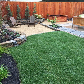Sunken gravel patio to address site drainage
