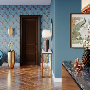Eclectic entryway in New York with blue walls, medium hardwood floors, a single front door, a brown front door and brown floor.