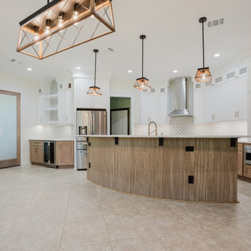 Open-Concept Kitchen with Arched Island and Two-Tone Cabinetry