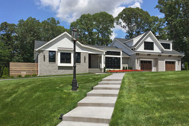 Large transitional gray two-story mixed siding exterior home photo in Philadelphia with a mixed material roof