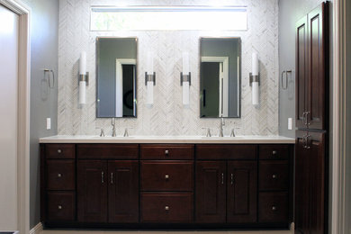 Large transitional master bathroom in Los Angeles with raised-panel cabinets, dark wood cabinets, a one-piece toilet, white tile, mosaic tile, grey walls, porcelain floors, an undermount sink and quartzite benchtops.