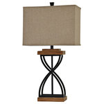 StyleCraft Home Collection - Black Metal X Lamp on Poly Base Natural Linen Shade - A subtle take on industrial-inspired decor, this table lamp features a black wood finish with brown accents. The rectangular hardback shade is made of beige fabric. The hourglass shape of the base ensures this black and brown lamp will enhance the look of a bedroom, living room, hallway, dining room, or office.