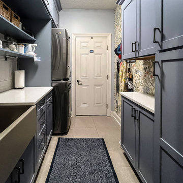 Laundry Room with Blue Painted Cabinetry and Sparkling White Quartz Countertops