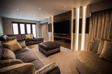 Photo of a medium sized modern enclosed living room in Other with carpet, no fireplace, a built-in media unit and grey floors.