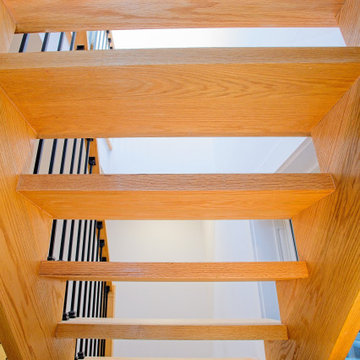 Underside of an Open-Riser Oak Staircase | East York