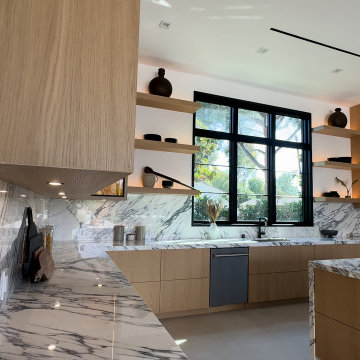 Kitchen with Full-Height Marble Slab Backsplash and Wood Hood - Studio City