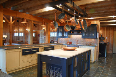 Example of a large mountain style u-shaped slate floor eat-in kitchen design in DC Metro with a farmhouse sink, shaker cabinets, white cabinets, solid surface countertops, red backsplash, brick backsplash, colored appliances and an island