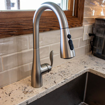 Two Tone Teal and Cream Kitchen with Romano White Quartz Countertop