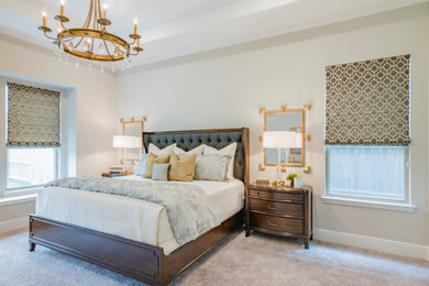 Inspiration for a large transitional master carpeted, beige floor and tray ceiling bedroom remodel in Houston with white walls