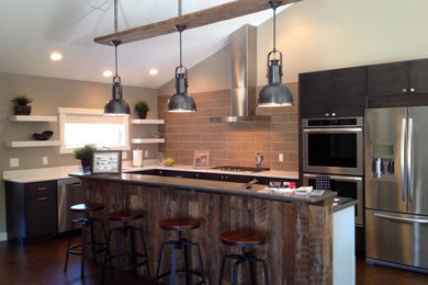 Example of a large mountain style l-shaped cork floor and brown floor enclosed kitchen design in New York with an undermount sink, flat-panel cabinets, medium tone wood cabinets, quartz countertops, gray backsplash, porcelain backsplash, stainless steel appliances and an island