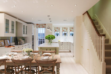 Inspiration for a modern kitchen remodel in London with an island