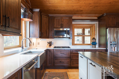 Large mountain style galley eat-in kitchen photo in Salt Lake City with a farmhouse sink and an island