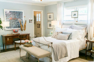 Mid-sized guest bedroom photo in Austin with blue walls
