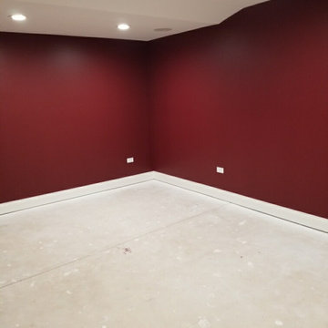 Basement Redesign with Paint, Trim, and Entertainment Space