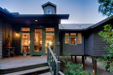 Example of a mid-sized brown one-story wood exterior home design in Miami with a hip roof