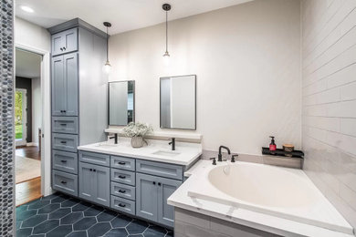 Mid-sized transitional master gray tile and ceramic tile porcelain tile, blue floor and double-sink bathroom photo in San Francisco with shaker cabinets, gray cabinets, a one-piece toilet, beige walls, an undermount sink, quartz countertops, white countertops and a built-in vanity