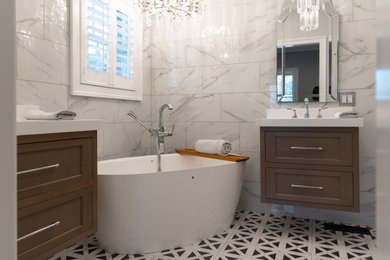 Inspiration for a small contemporary master white tile ceramic tile and double-sink bathroom remodel in St Louis with shaker cabinets, brown cabinets, white walls, an undermount sink, quartz countertops, white countertops and a floating vanity