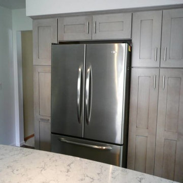 Medallion Cherry Peppercorn Cabinets with Rococo Quartz countertops