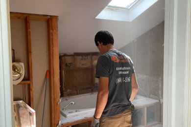 Inspiration for a large modern master white tile and porcelain tile double-sink bathroom remodel with shaker cabinets, white cabinets, quartzite countertops and white countertops