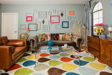 Inspiration for a mid-sized midcentury living room in Orange County with grey walls, light hardwood floors and no tv.