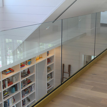 Glass Balustrade with Aluminum Base Rail Finished with Satin Brass Cladding