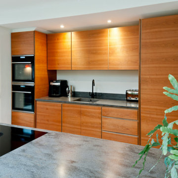 Contemporary large plywood kitchen with cherry veneer