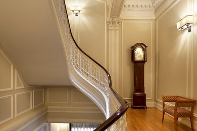 Design ideas for a mid-sized traditional hallway in New York with beige walls and light hardwood floors.