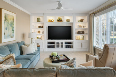 Family room - mid-sized carpeted and beige floor family room idea in Other with beige walls