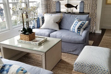 Inspiration for a small transitional open concept medium tone wood floor and brown floor living room remodel in Chicago with white walls, a standard fireplace and a wood fireplace surround