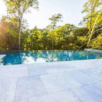 Luxury vanishing edge swimming pool and outdoor living area Ridgewood NJ