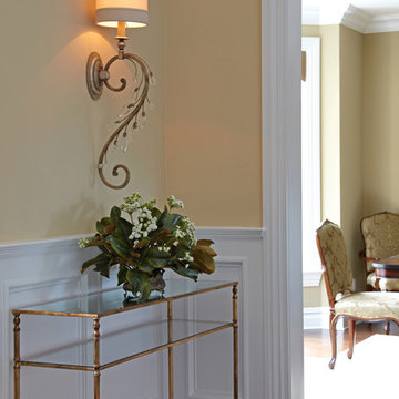 Gold Leaf Consoles & Oversized Crystal Wall Sconces