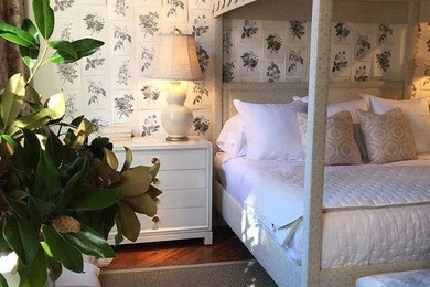 Small trendy guest medium tone wood floor and brown floor bedroom photo in Baltimore with multicolored walls