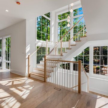 Project #152 | Three-Story White Oak Staircase with a Pendant Chandelier