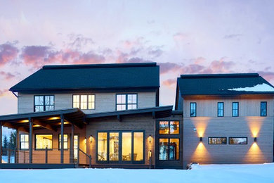 Example of a trendy brown two-story exterior home design in Denver with a shingle roof