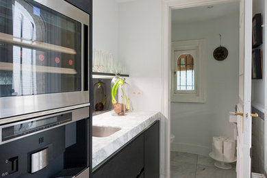 Example of an eclectic kitchen design in Other