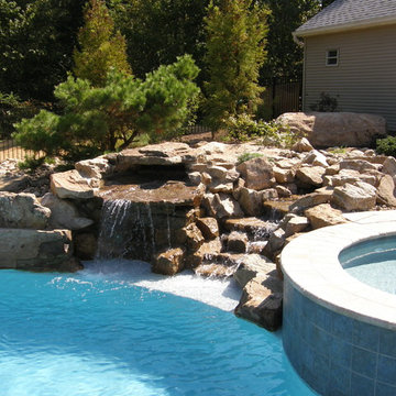 Pool oasis with stream and waterfall