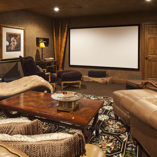 Photo of an eclectic home cinema in Minneapolis with a projector screen.