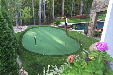 Design ideas for a mid-sized traditional partial sun backyard outdoor basketball/tennis/multi-game court in Charlotte.