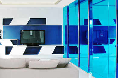 Living room - large modern formal and open concept ceramic tile living room idea in Denver with gray walls, no fireplace and a media wall