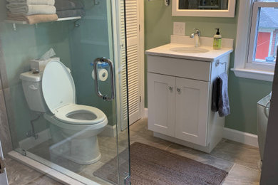 Example of a transitional bathroom design in Philadelphia with a hinged shower door