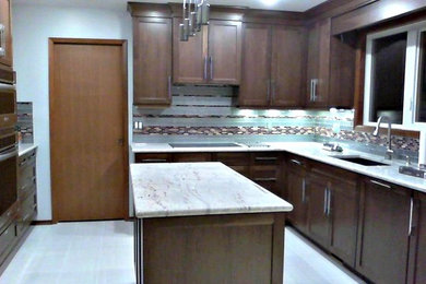 Inspiration for a large contemporary l-shaped gray floor eat-in kitchen remodel in Other with an undermount sink, shaker cabinets, dark wood cabinets, marble countertops, multicolored backsplash, glass tile backsplash, stainless steel appliances and an island