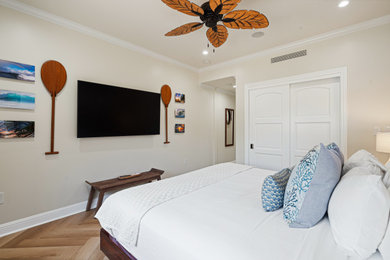 Inspiration for a mid-sized coastal vinyl floor and brown floor bedroom remodel in Hawaii with yellow walls