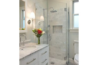 Small minimalist 3/4 multicolored tile laminate floor and multicolored floor bathroom photo in St Louis with furniture-like cabinets, white cabinets, a two-piece toilet, white walls, an undermount sink, onyx countertops, a hinged shower door and multicolored countertops