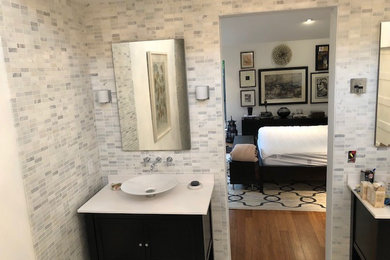 Inspiration for a mid-sized modern master bathroom in Dallas with furniture-like cabinets, dark wood cabinets, gray tile, white tile, engineered quartz benchtops, white benchtops, grey walls and a vessel sink.