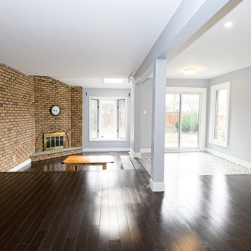 Open Living Room Space with Exposed brick and Fireplace