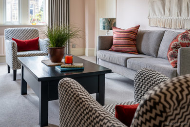 Mid-sized eclectic living room photo in Other with pink walls