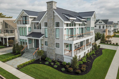 Example of a trendy house exterior design in Philadelphia with a metal roof