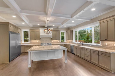 Inspiration for a large craftsman u-shaped light wood floor eat-in kitchen remodel in Seattle with an undermount sink, shaker cabinets, white cabinets, granite countertops, beige backsplash, subway tile backsplash, stainless steel appliances, an island and beige countertops